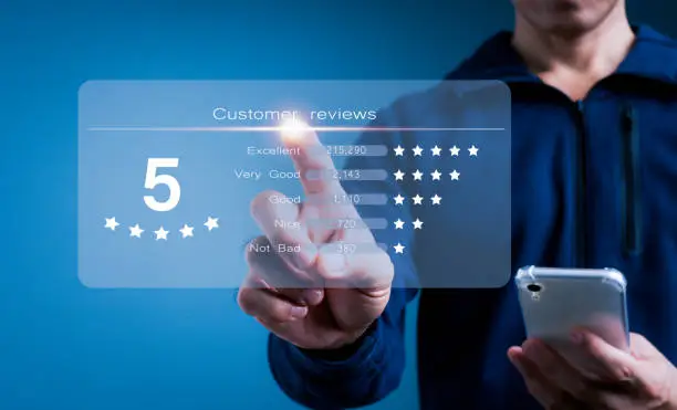Photo of Customer gives rating to service, experience can evaluate a quality of service leading to reputation ranking of business on online application,Concept is Customer review satisfaction feedback survey.