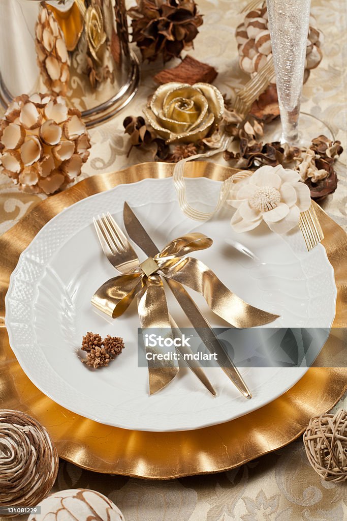 Gold place setting Beautiful and elegant gold place setting for christmas or celebrations Arrangement Stock Photo