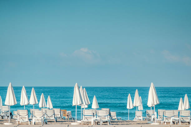 istock Morning sea, beach, empty sun beds for vacationers. Vacation concept. 1340815025