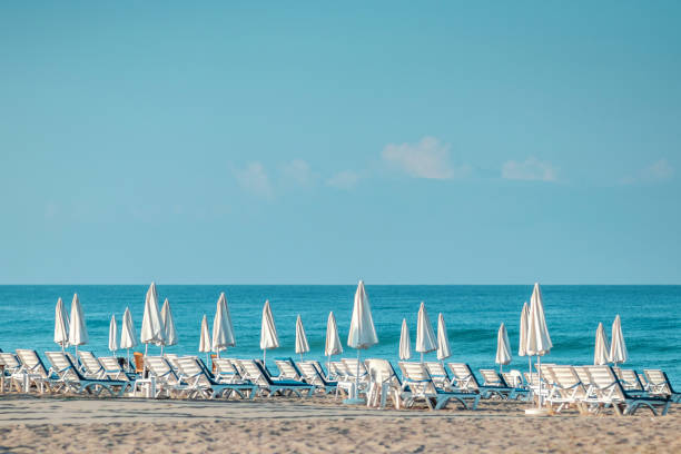 istock Morning sea, beach, empty sun beds for vacationers. Vacation concept. 1340815034