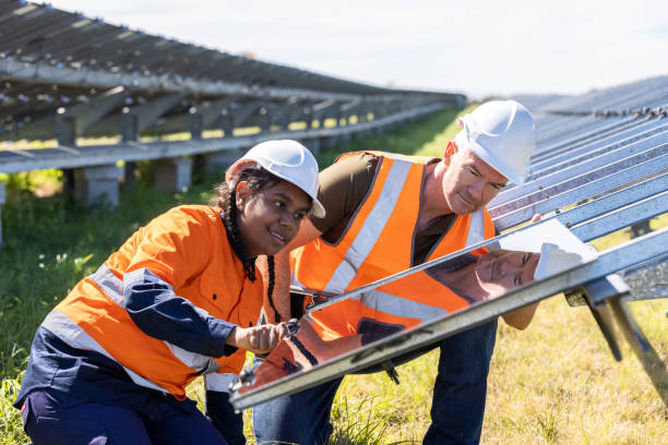 istock Senior Engineer and Aboriginal Australian Apprentice Working Together On Solar Farm Installation 1340816903
