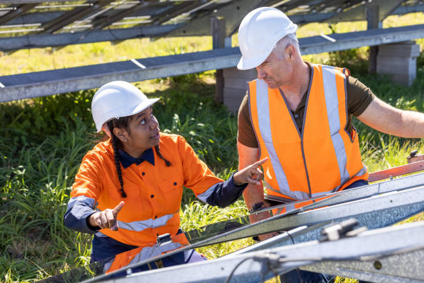 istock Senior Engineer and Aboriginal Australian Apprentice Working Together On Solar Farm Installation 1340816917