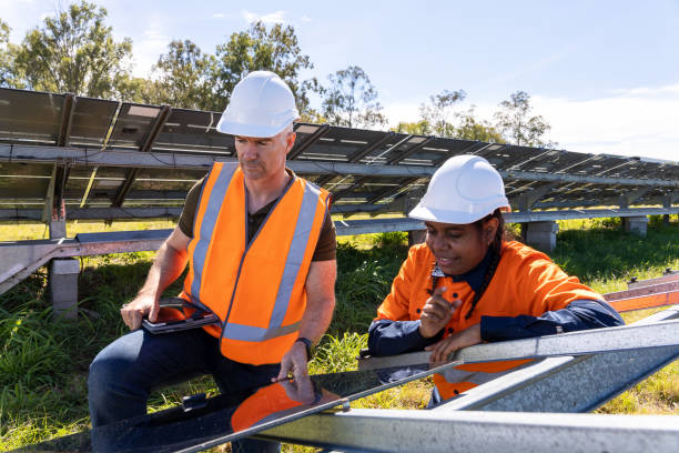 istock Senior Engineer and Aboriginal Australian Apprentice Working Together On Solar Farm Installation 1340816922