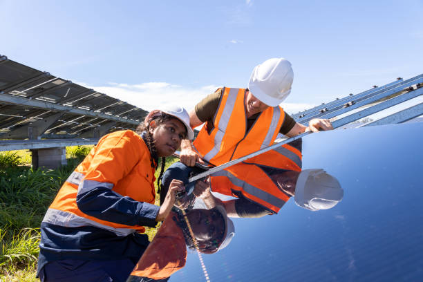 istock Senior Engineer and Aboriginal Australian Apprentice Working Together On Solar Farm Installation 1340816928