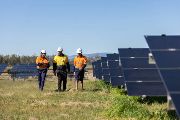 istock Multiracial Group Of Three Technicians Surrounded By Solar Panels 1340817516