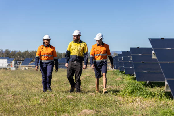 istock Multiracial Group Of Three Technicians Surrounded By Solar Panels 1340817526