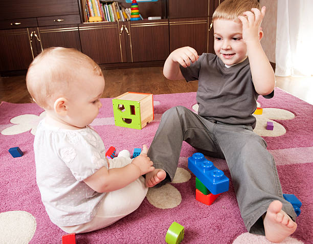 istock Brother and sister playing 134081776