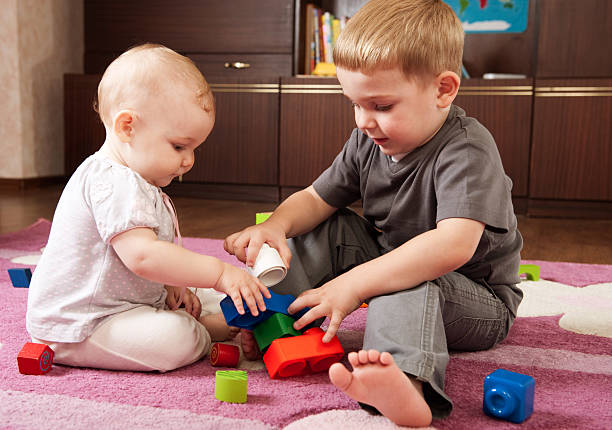 istock Brother and sister playing 134081778