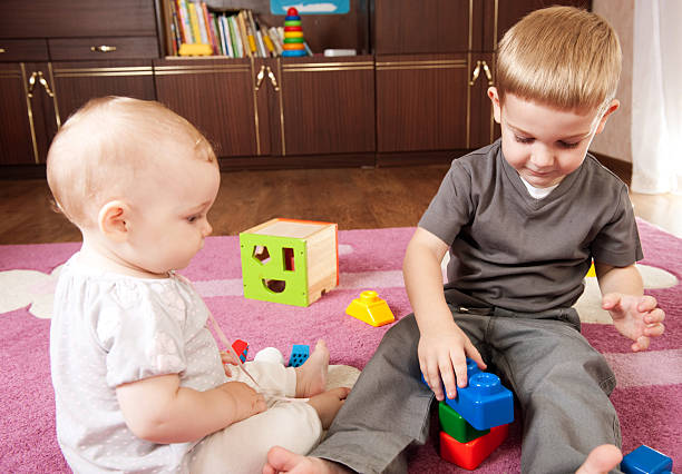 istock Brother and sister playing 134081799