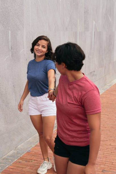 istock Lesbian couple walking down the street. 1340821331