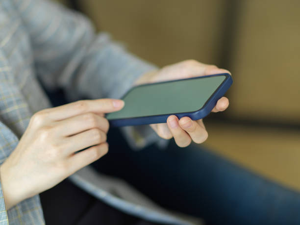 istock Cropped shot, female using smartphone while sitting in office. contact, text, message, email 1340822185