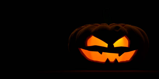 istock At right frame enlighted Halloween pumpkin with large copy space 1340823182
