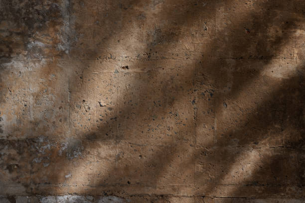 istock Part of an old concrete wall with shadows 1340826253