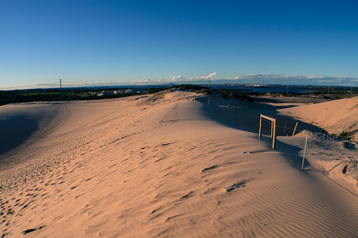 This place is popular in Sahara Desert, where you can see fata morgana, mirage - those hills in the distance are not real