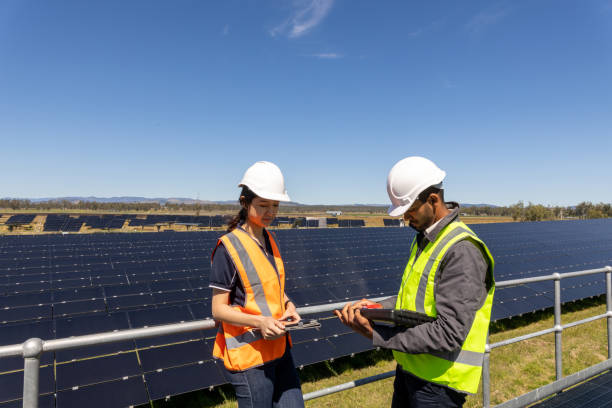 istock Engineers Working Together On Solar Farm Installation 1340827942