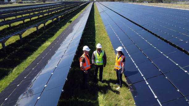 istock Multiracial Group Of Three Engineers Surrounded By Solar Panels 1340827962