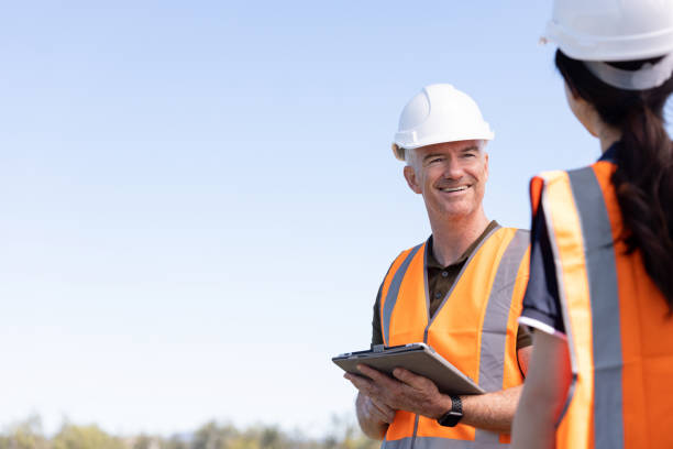 Engineers Working Together On Solar Farm Installation