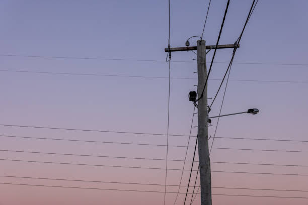 Silhouette Of High Voltage Powerlines At Dusk