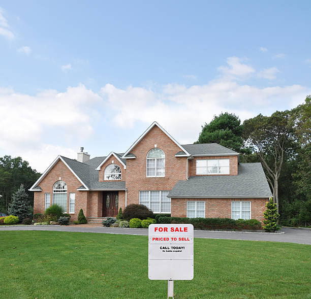 istock For Sale Sign on Suburban Front Yard Lawn 134082805