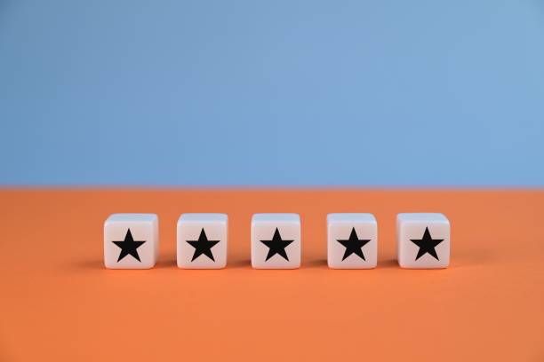 istock Five stars on blocks. Customer services best excellent business rating experience. Satisfaction survey concept. 1340829189