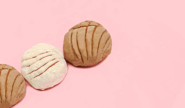 istock sweet bread called cochas, pink background.,copy space 1340832668