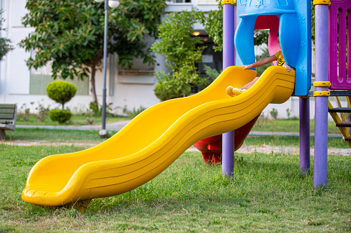 Children's playground at the public park of city on a sunny day. Izmir province of  Turkey.
