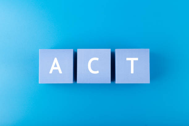 istock Act single word written on blue toy blocks on blue background 1340843542