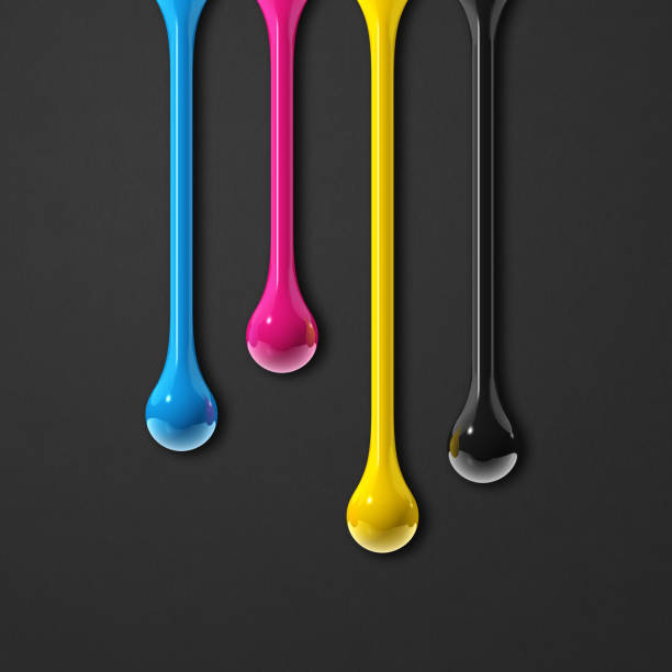 istock cmyk ink drops on black paper square background 1340845026
