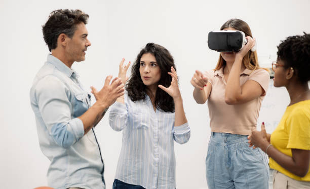 istock group of office workers use virtual reality glasses in a conwoking 1340848008