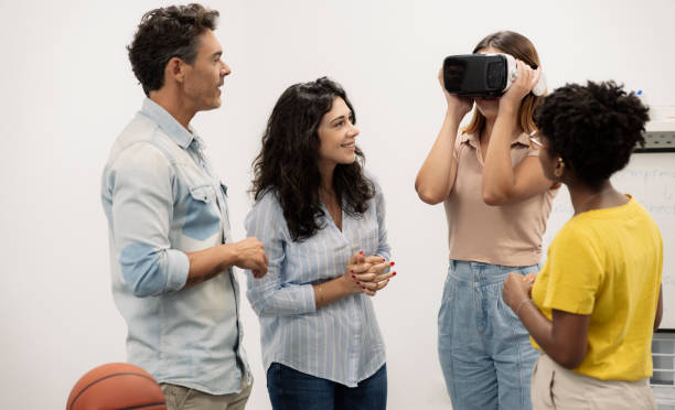 group of people use virtual reality glasses in an office