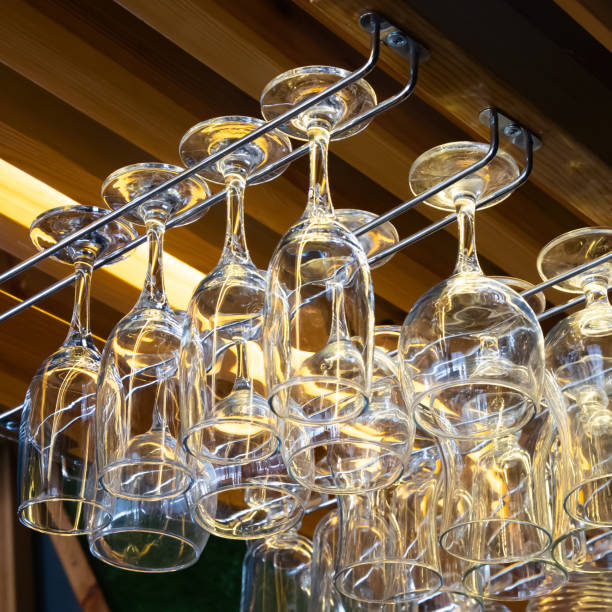 istock clean wine glasses hang over the bar. Glass, utensils, objects. 1340848816