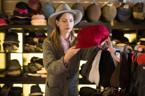 istock Woman choosing hat in store 1340852145
