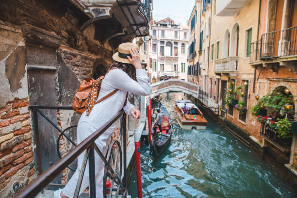 istock woman looking at canal with gandola 1340853073