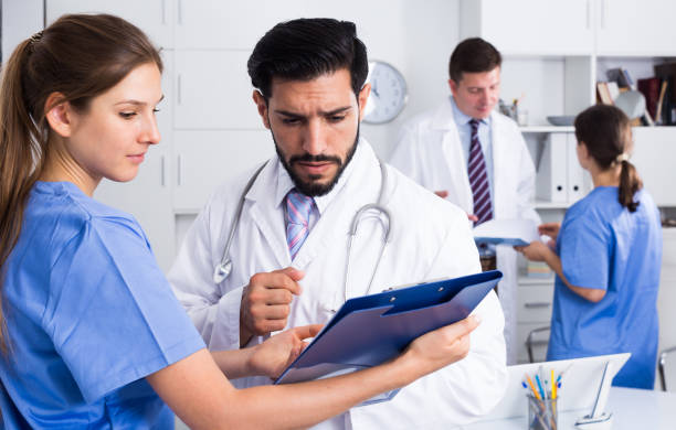 istock Doctors having discussion in medical office 1340853339