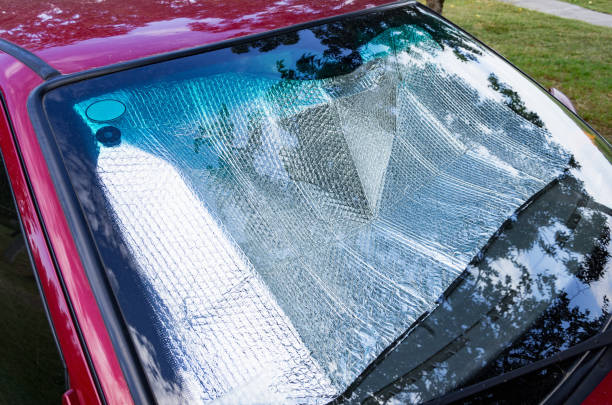 istock Protective reflective sunscreen foil under windshield of car. 1340854445