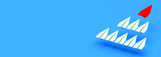 istock Leadership concept. Red leader plane leads other planes forward with blank copy space background 1340856039