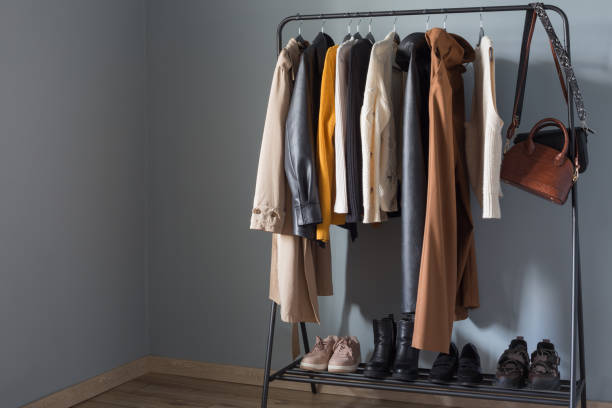 istock basic women's autumn wardrobe with shoes and handbags on  hanger 1340858555
