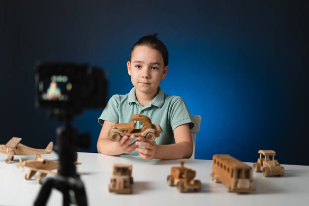 istock Young boy video blogger making stream with his followers. 1340860011