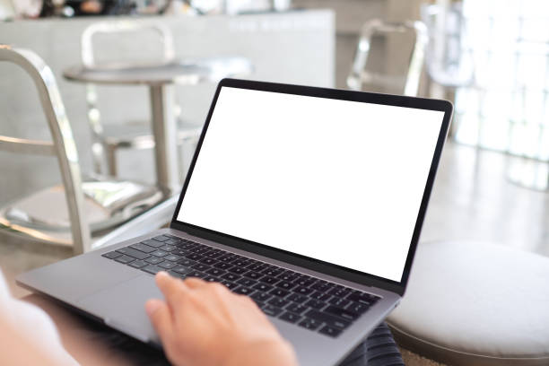 istock a woman using and touching on laptop touchpad with blank white desktop screen 1340861129