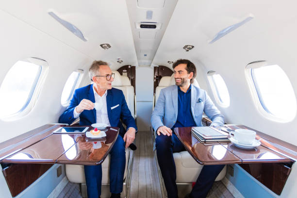 istock Two businessmen traveling by corporate jet 1340861846