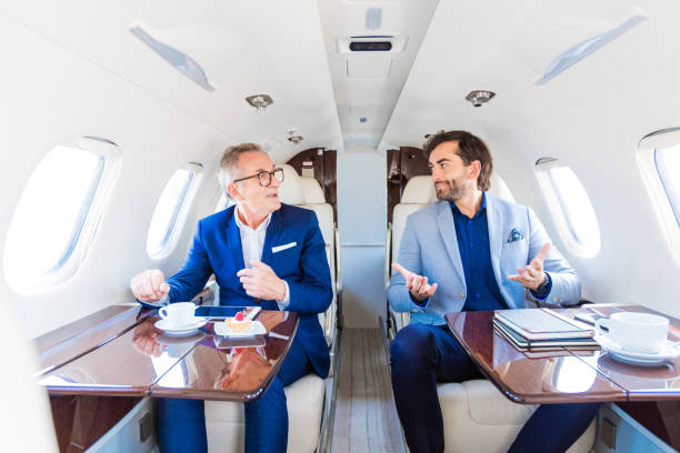 istock Two businessmen traveling by corporate jet 1340862229