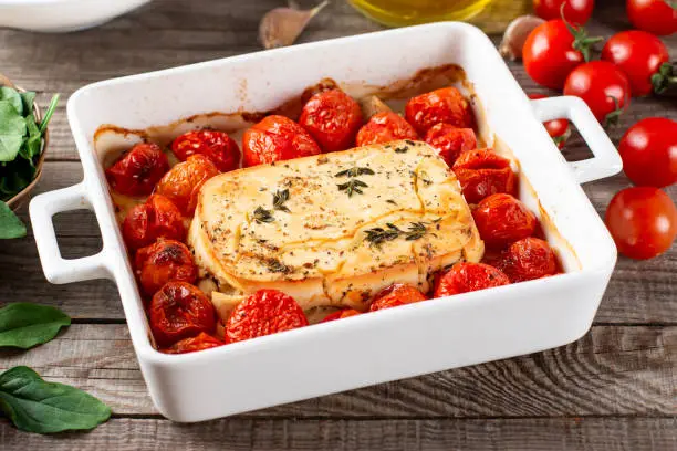 Baked feta pasta. Feta cheese and tomatoes in garlic oil. In the oven it turns into an amazing pasta sauce by itself. Just add some cooked pasta, mix and enjoy. Tiktok pasta