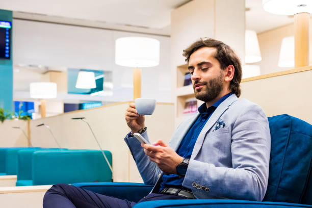 istock Businessman using tablet PC at airport lounge 1340864600