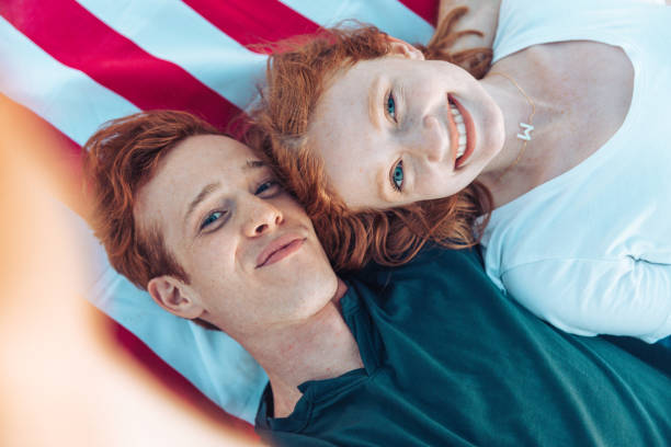 istock Adorable adolescent couple by the beach 1340866350