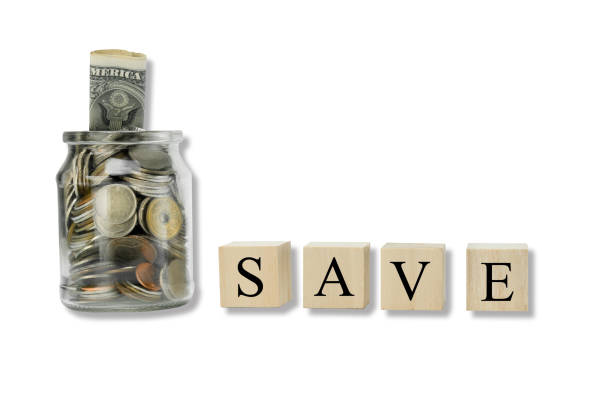 istock Coins in glass jar with copy space on isolated white. 1340866453