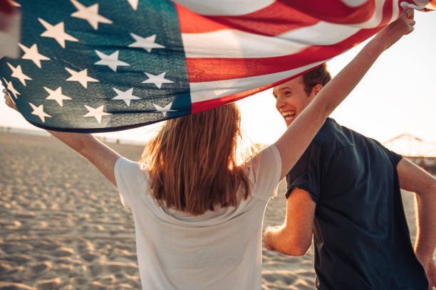 istock Beautiful young couple by the beach 1340866601