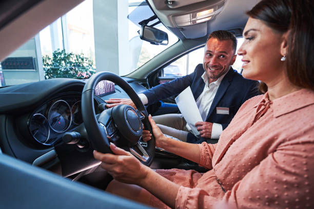 istock Happy manager demonstrating the navigation system in the car 1340867510