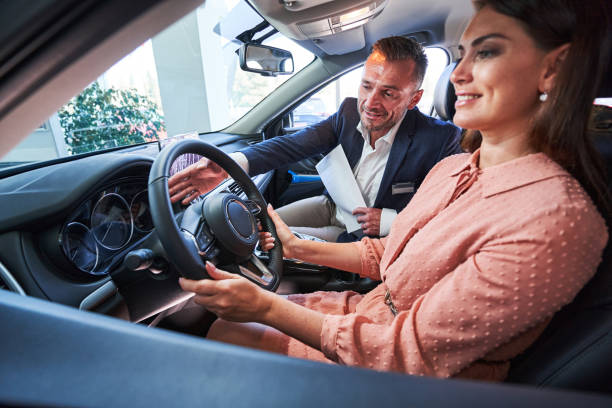 istock Female driver looking satisfied with her new modern car 1340867514