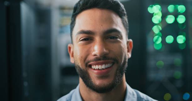 istock Shot of a young male engineer working in a server room 1340867925