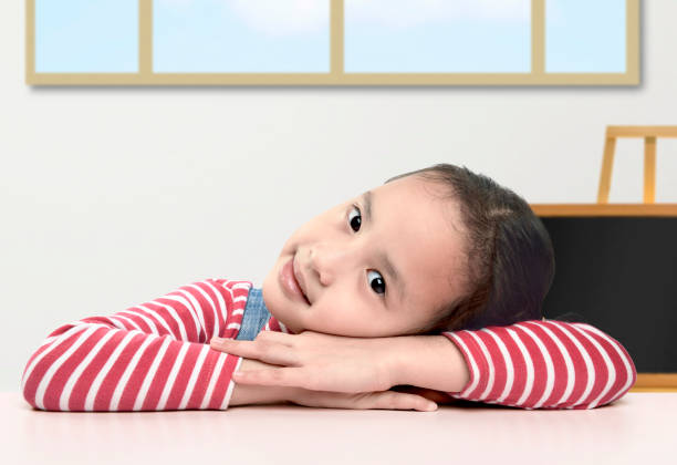 The girl is lying on the ground at home